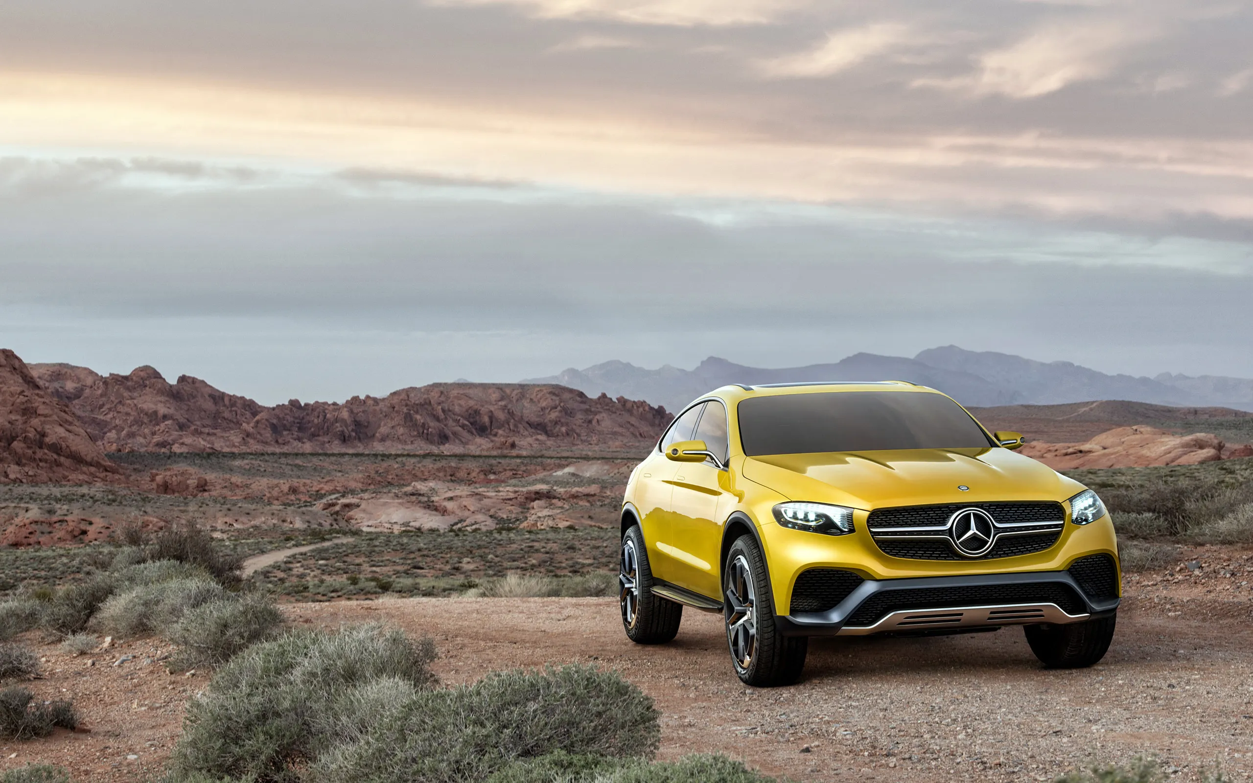 Yellow Mercedes Benz SUV Parked in Desert Landscape